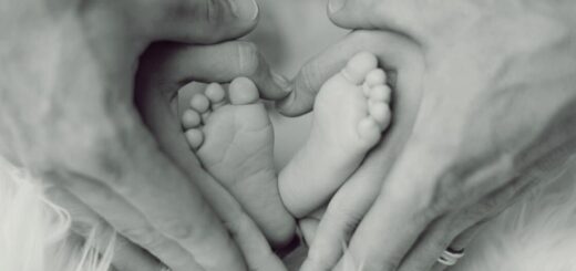 hands holding baby feet